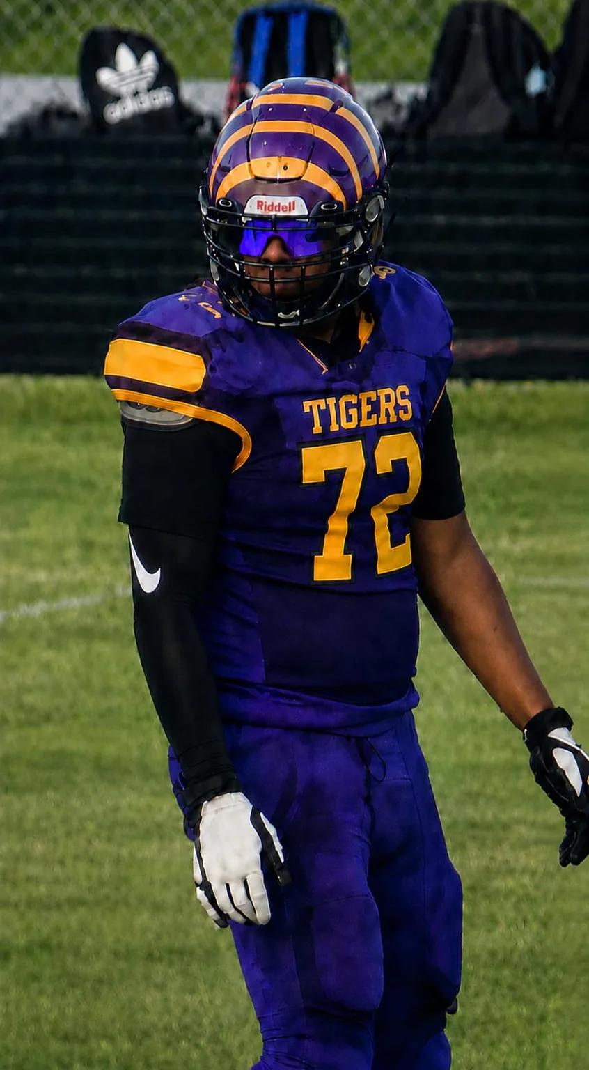 Young football athlete wearing sports eyewear